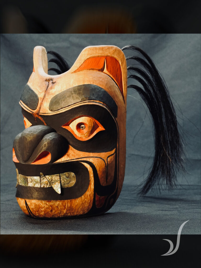 Hand carved Tlingit bear mask titled Duxux
